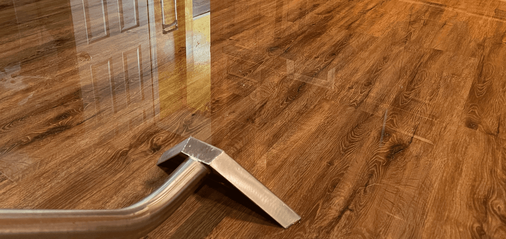 Professional water extraction removing standing water from a flooded room — Bulldog Cleaning & Restoration